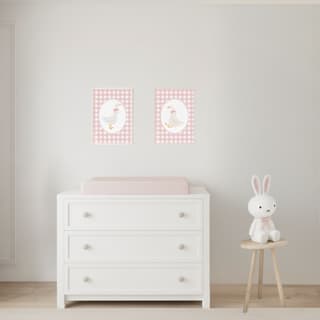 Girls’ nursery changing table area styled with cozy farmhouse accents, soft pink tones, and functional baby storage. Includes Sweet Jojo Designs crib bedding coordinating with decor for a warm, storybook-inspired baby room.”