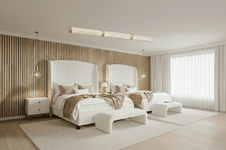 Bedroom features two beds with white headboards, tan throws, and wood-paneled wall.