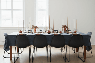 Tu Bshvat 2 Elegant tablescape with tall candles, pomegranates, berries, and crystal glassware.